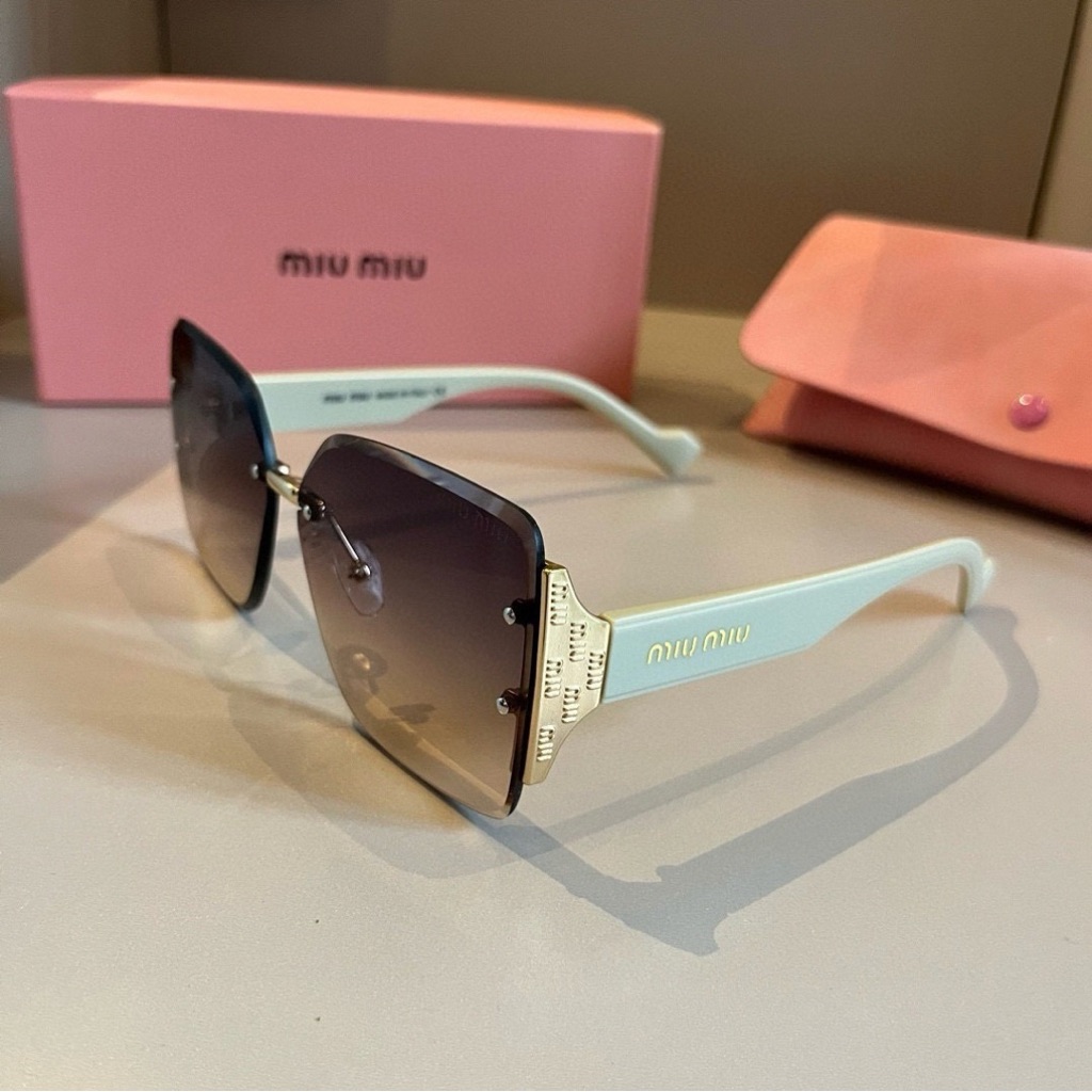 Miu Miu Teal-Green Frame Sunglasses With Light Brown Lenses